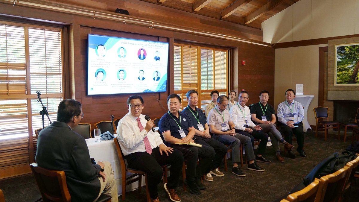RoboStreet CEO William Wei Wang speaking on a roundtable panel at the 2025 Global Green Development Summit at Stanford